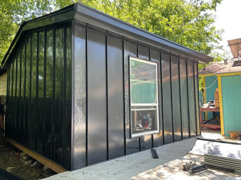 Black standing seam metal wall panels for Roof Inspection in Cedar Park