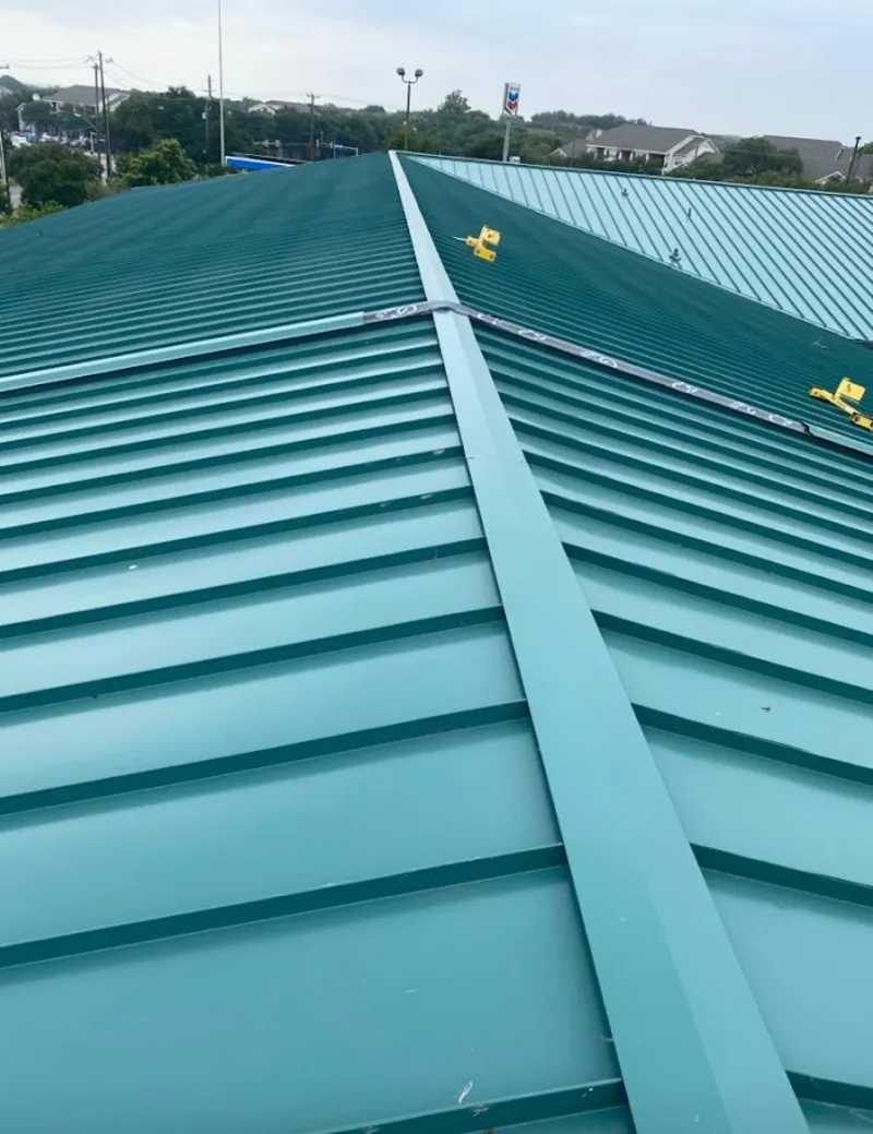 Green commercial metal roof ridge and valley for Metal Roof Repair in Cedar Park
