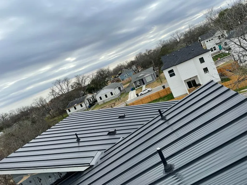 Standing seam metal roof panels with vents for Skylight Repair in Cedar Park